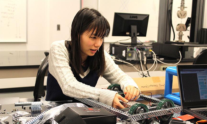 student working with wiring